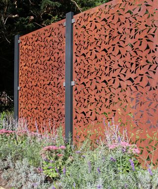 corten steel fence panels in a garden