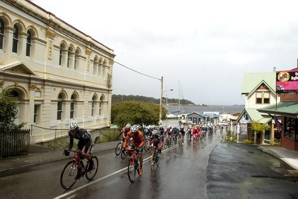 The peloton head up the climb in the fishing and tourist township of Strahan on the opening stage of the tour.