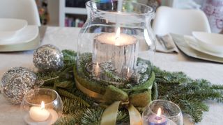 Candle centerpiece on table