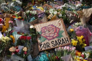 Floral tributes and a poster saying 'for Sarah' are placed in tribute to Sarah Everard on Clapham Common on March 15, 2021