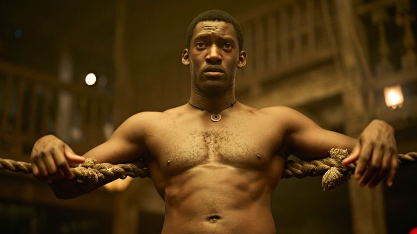 A shirtless Hezekiah Moscow (Malachi Kirby) rests against the ropes of a boxing ring in a scene from "A Thousand Blows" season 1