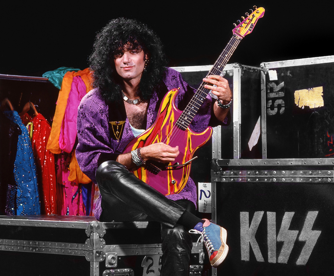 Bruce Kulick poses backstage with a guitar in New York City in 1985