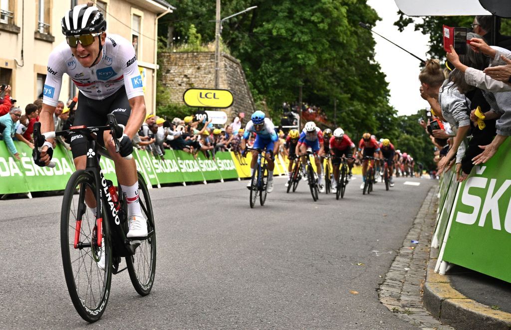 UAE Team Emirates teams Slovenian rider Tadej Pogacar L cycles to the finish line to win the 6th stage of the 109th edition of the Tour de France cycling race 2199 km between Binche in Belgium and Longwy in northern France on July 7 2022 Photo by Marco BERTORELLO AFP Photo by MARCO BERTORELLOAFP via Getty Images