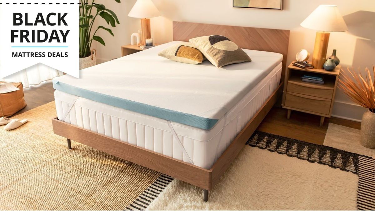 The Tempur-adapt topper on mattress on a bed frame in a well lit room