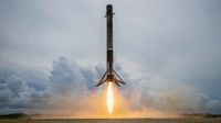 A SpaceX Falcon 9 rocket touches down at Cape Canaveral Space Force Station in Florida after launching the Transporter-2 rideshare mission to orbit, on June 30, 2021. 
