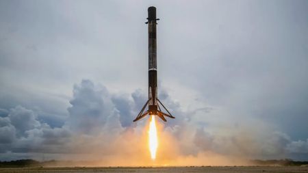 A SpaceX Falcon 9 rocket touches down at Cape Canaveral Space Force Station in Florida after launching the Transporter-2 rideshare mission to orbit, on June 30, 2021. 