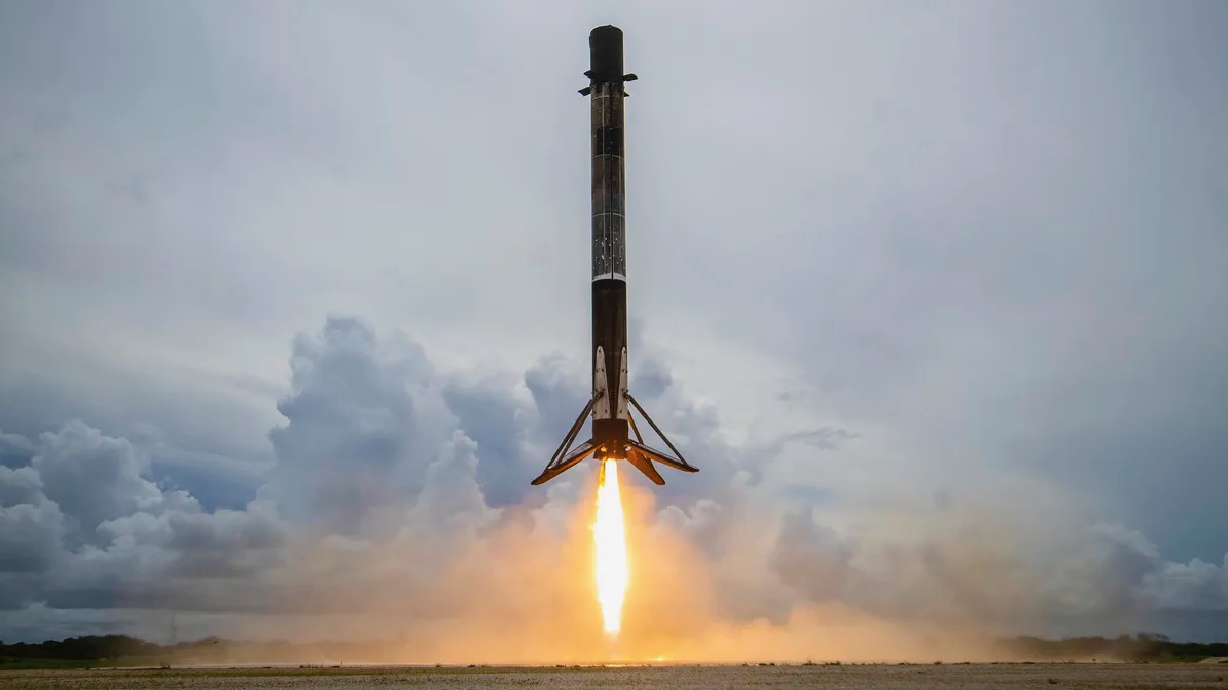 A SpaceX Falcon 9 rocket touches down at Cape Canaveral Space Force Station in Florida after launching the Transporter-2 rideshare mission to orbit, on June 30, 2021. 