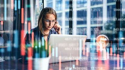 A young woman reviews her investment portfolio.