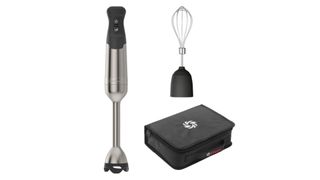 The Vitamix Immersion Blender next to its whisk and storage case against a transparent background