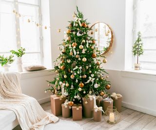Fir Christmas tree in a room decorated for the season