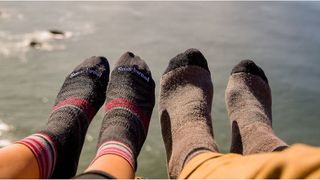 Two people's feet wearing hiking socks