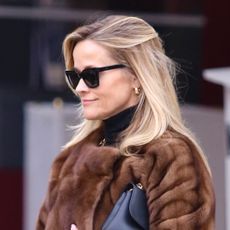 Reese Witherspoon Styles a Luxe Fur Coat With Chunky Black Boots and a Classic Bag