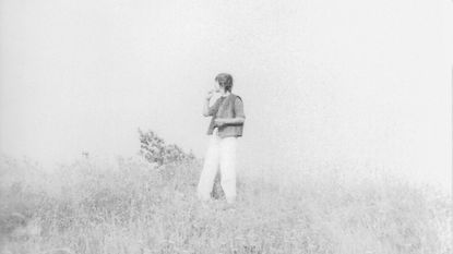 woman standing in a field