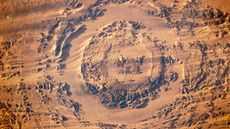 A satellite photo of an impact crater in the shape of an eye