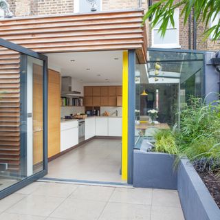 Rear of house with modern glass box kitchen extension