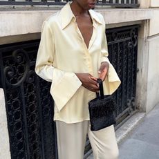 Woman in a satin top and pants 