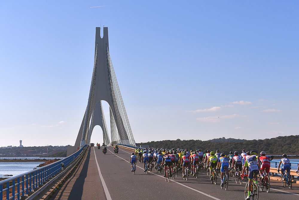The peloton crosses a bridge during stage 2 at Volta ao Algarve