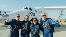 Virgin Galactic founder Richard Branson (right) and the crew of Unity 22 celebrate their successful suborbital launch over Spaceport America, New Mexico after landing on July 11, 2021. Branson's crewmates are: (from left) Colin Bennett, Beth Moses and Sirisha Bandla, all Virgin Galactic employees.