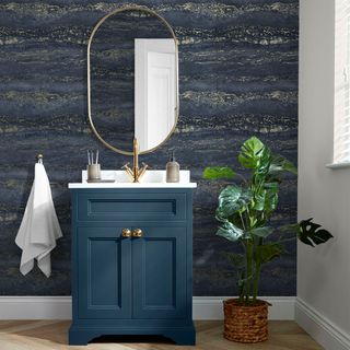 Bathroom with dark blue wallpaper and vanity unit