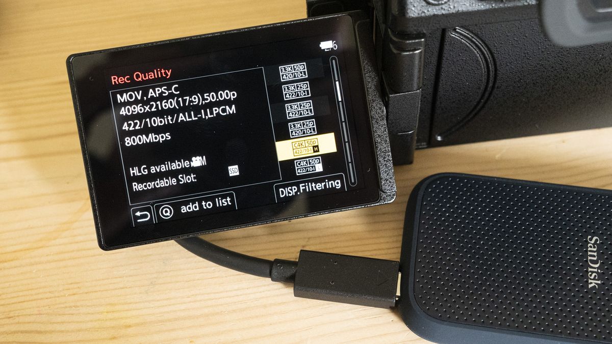 Panasonic Lumix S5 IIX camera on a table with ALL-Intra recording option on touchscreen