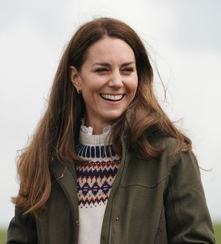 Catherine, Duchess of Cambridge, laughs during their visit to Manor Farm in Little Stainton, Durham on April 27, 2021 in Darlington, England