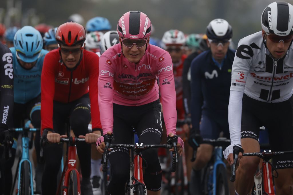 Team Sunweb rider Netherlands Wilco Kelderman C wearing the overall leaders pink jersey rides with the pack during the 19th stage of the Giro dItalia 2020 cycling race a 258kilometer route between Morbegno and Asti on October 23 2020 Heavy rain has interrupted on October 23 2020 the 19th stage of the Giro dItalia following protests by the riders in the face of difficult weather conditions Todays stage was planned to be a flat 258km ride between Morbegno and Asti but was cut back 100km after riders revolted when faced with pelting rain in the northern region of Lombardy Photo by Luca Bettini AFP Photo by LUCA BETTINIAFP via Getty Images