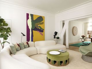 large white living room with a white curved sofa and round green coffee table