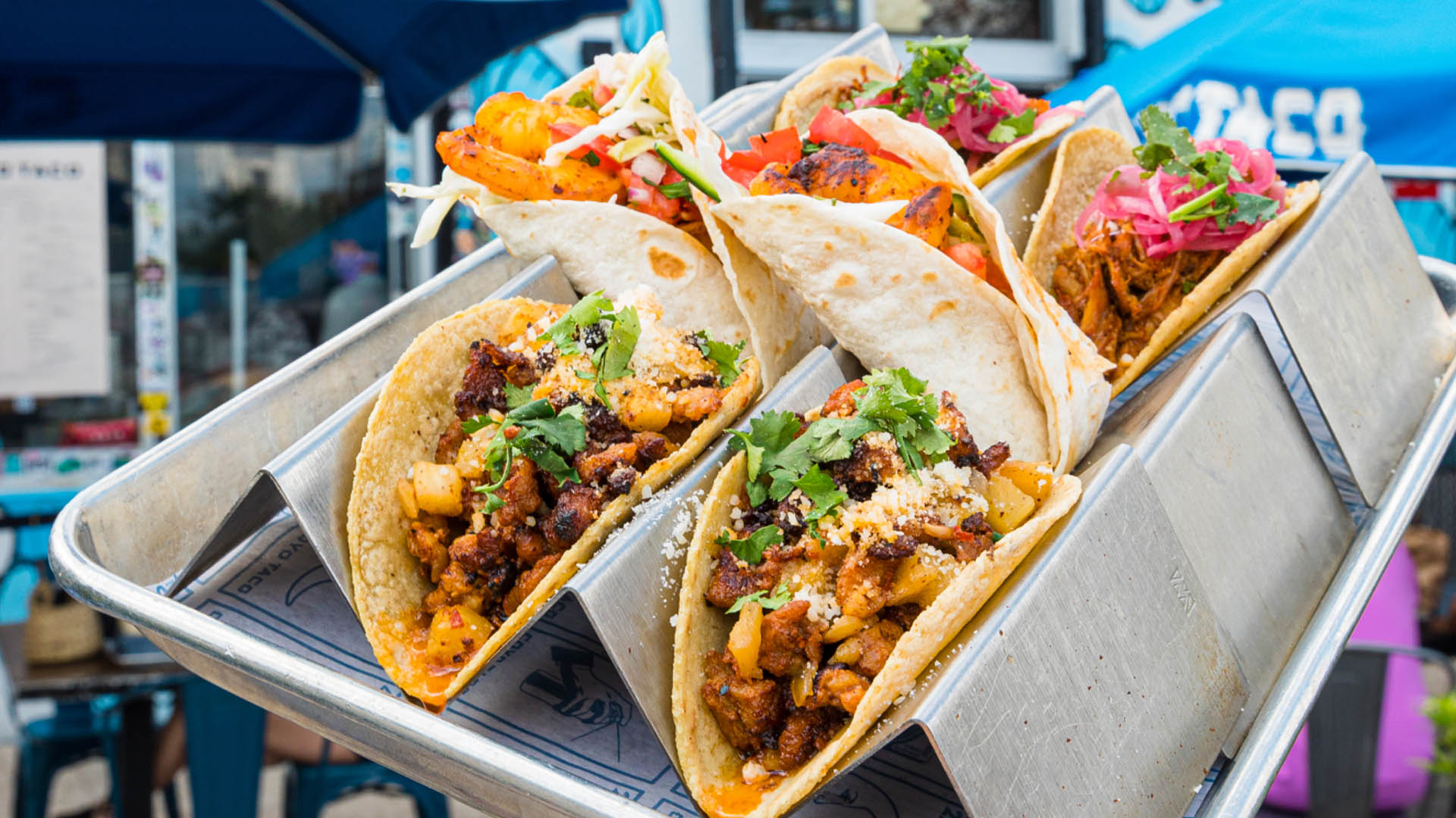 A photo of a platter of tacos.