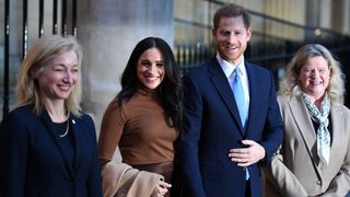 Prince Harry and Meghan, Duchess of Sussex stand with the High Commissioner for Canada in the United Kingdom, Janice Charette (R) and the deputy High Commissioner, Sarah Fountain Smith in 2020