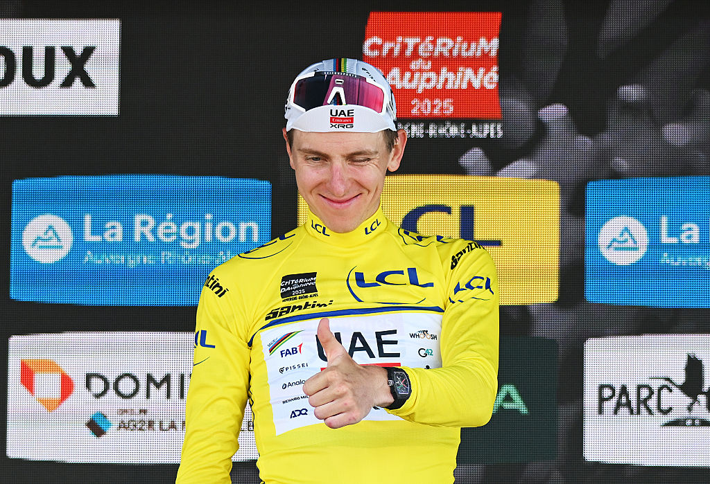 COMBLOUX, FRANCE - JUNE 13: Tadej Pogacar of Slovenia and UAE Team Emirates - XRG celebrates at podium as Yellow leader jersey winner during the 77th Criterium du Dauphine 2025, Stage 6 a 126.7km stage from Valserhone to Combloux 1183m / #UCIWT / on June 13, 2025 in Combloux, France. (Photo by Dario Belingheri/Getty Images)