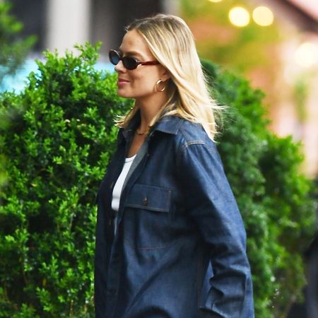 Margot Robbie wearing a dark denim outfit in NYC