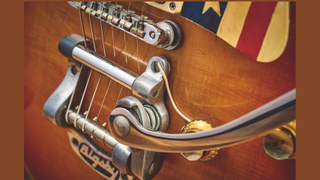A 1960s Les Paul Standard guitar close up on the bridge