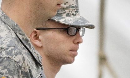 Bradley Manning (right) is escorted to the courthouse Sunday for the third day of his hearing: The alleged WikiLeaker was incarcerated for 18 months before getting his day in court.
