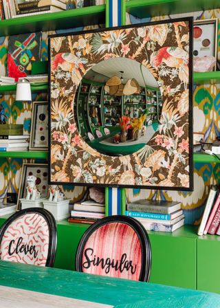 Green shelves with colourful pattern backing