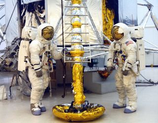 Apollo 13 astronauts Jim Lovell (at left) and Fred Haise pose at the base of a lunar module simulator in January 1970.