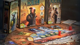 7 Wonders Duel and pieces on a wooden table