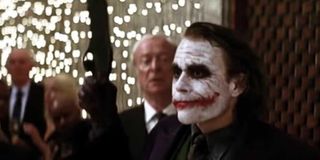 Michael Caine and Heath Ledger in The Dark Knight