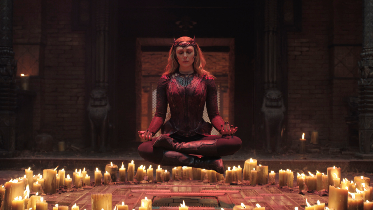 Elizabeth Olsen lifts over a ring of candles in Doctor Strange in the Multiverse of Madness.