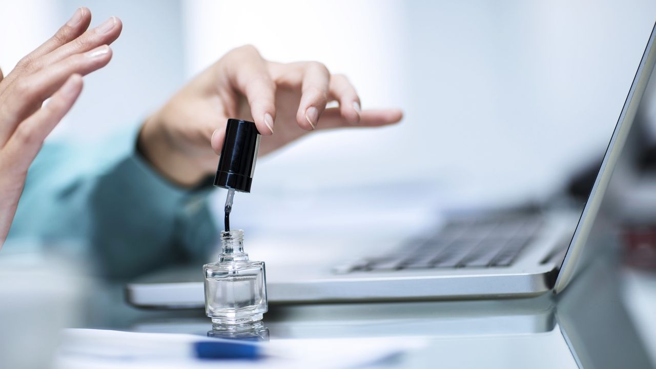 woman painting nails