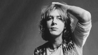 Kevin Ayers ruffling his own hair: studio portrait, 1973