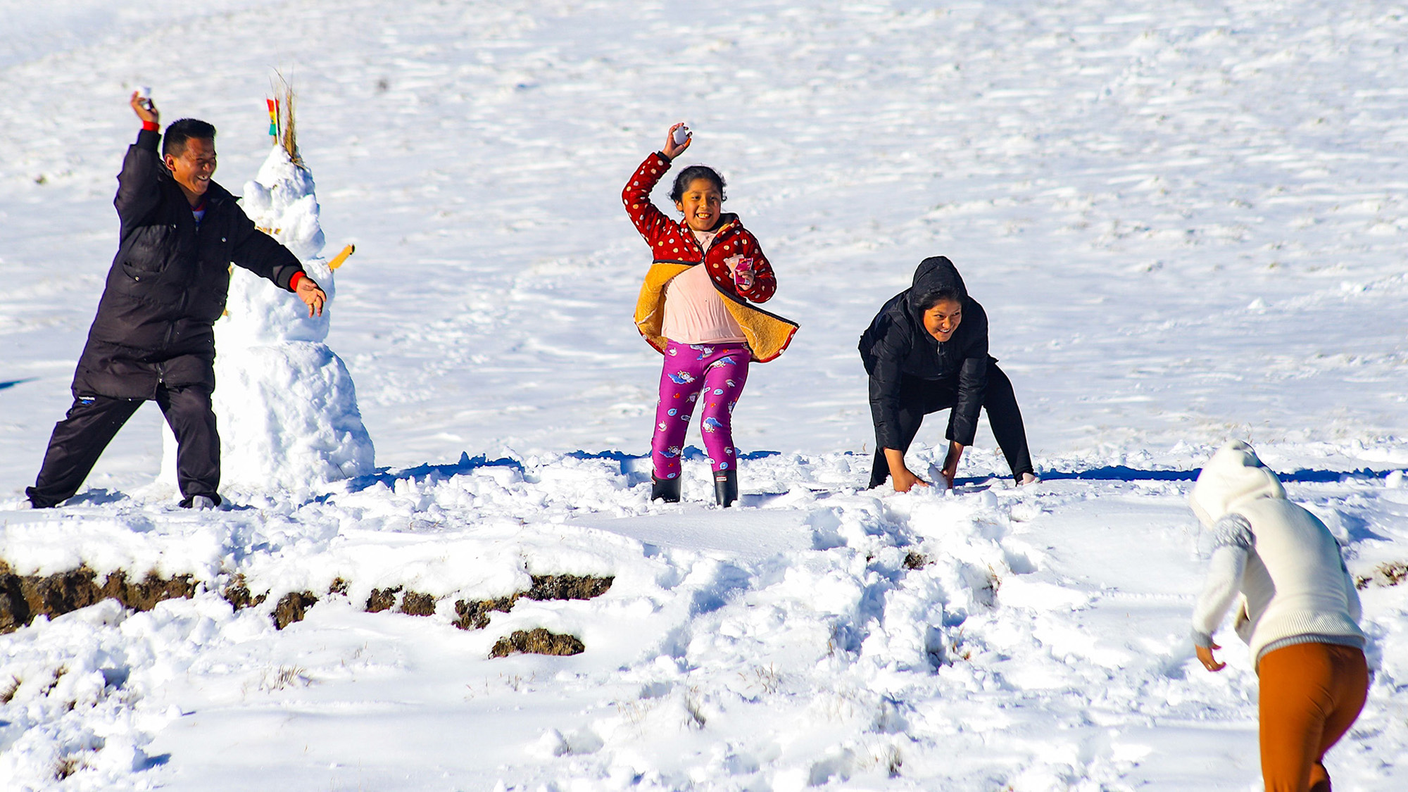 People play in the snow following extreme snowfall in La Cumbre, La Paz, Bolivia