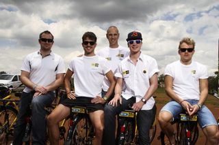 The German contingent poses on the backs of Qhubeka bikes