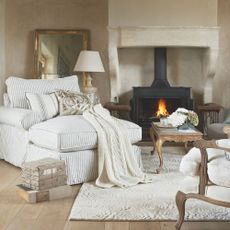 Subtle champagne living room scheme with striped and stone accents