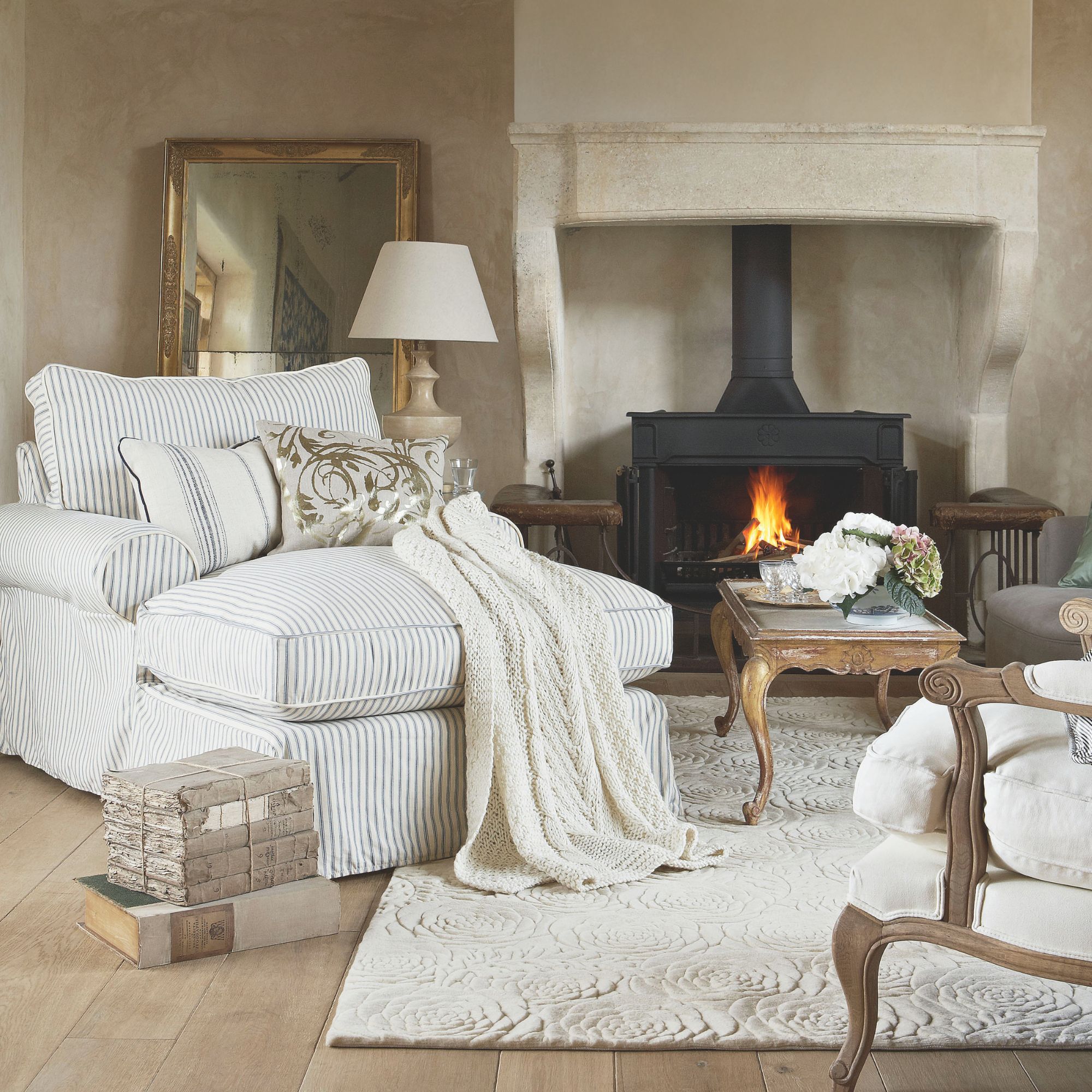 Subtle champagne living room scheme with striped and stone accents