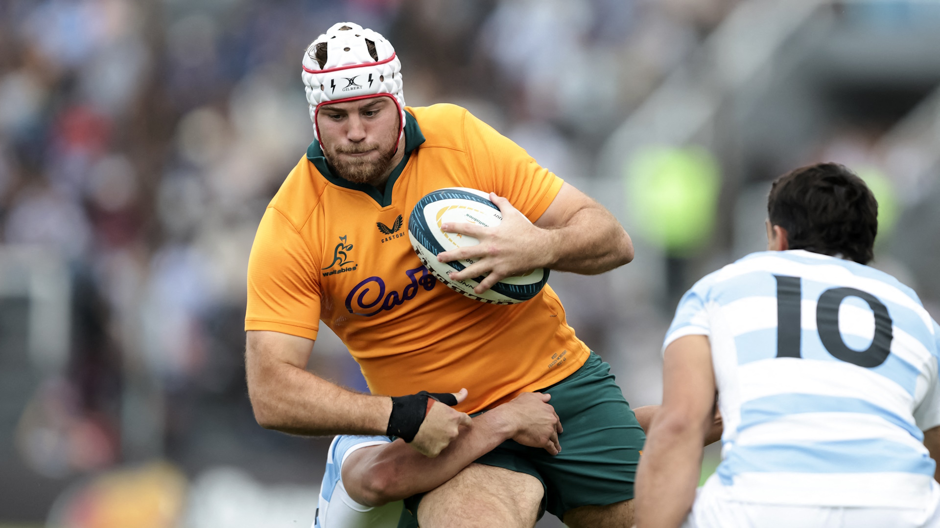 Australia's flanker Fraser McReight struggles to elude Argentina's fly-half Santiago Carreras during the Rugby Union test match between Argentina and Australia San Salvador de Jujuy.