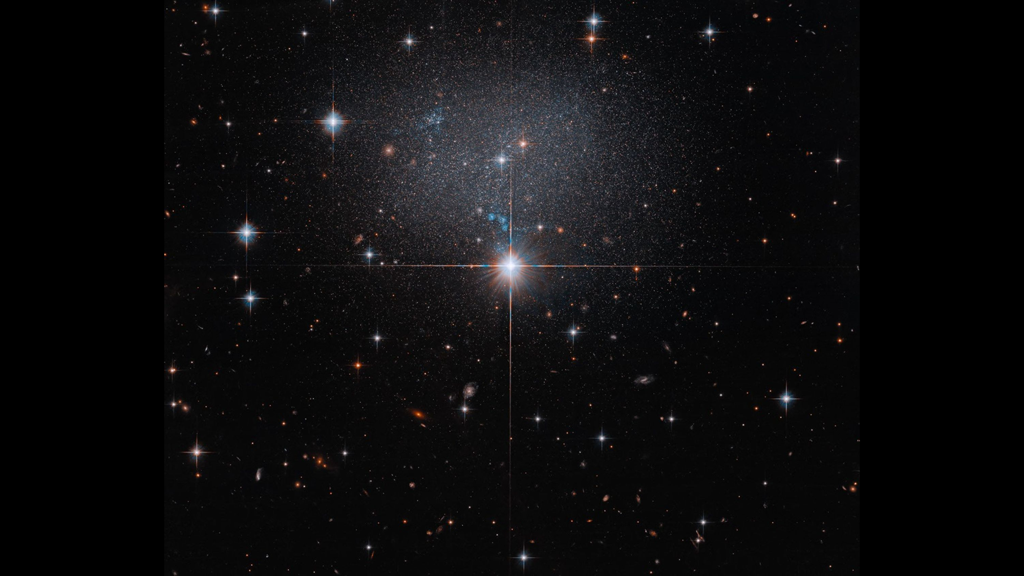 Hubble spies a swarm of stars in a strange, irregular galaxy photo of the day for 15, 2026