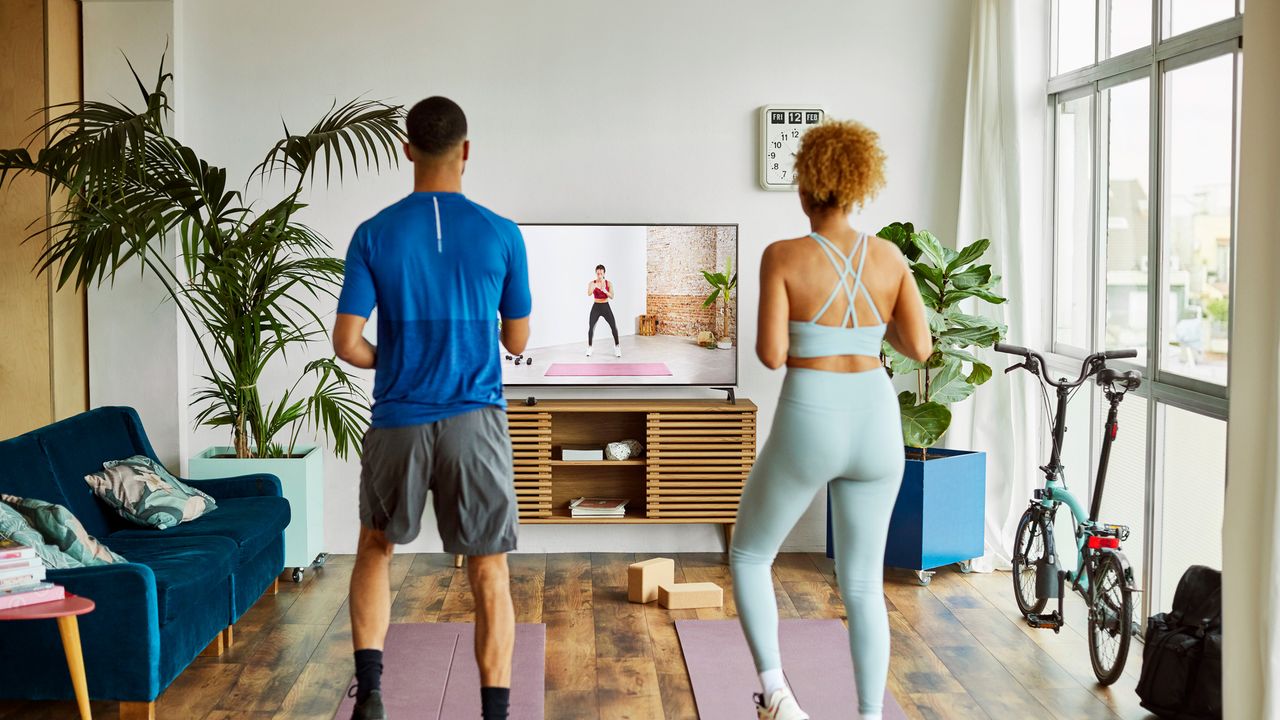 Couple doing a HIIT home workout