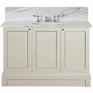 A muted vanity with a stone top