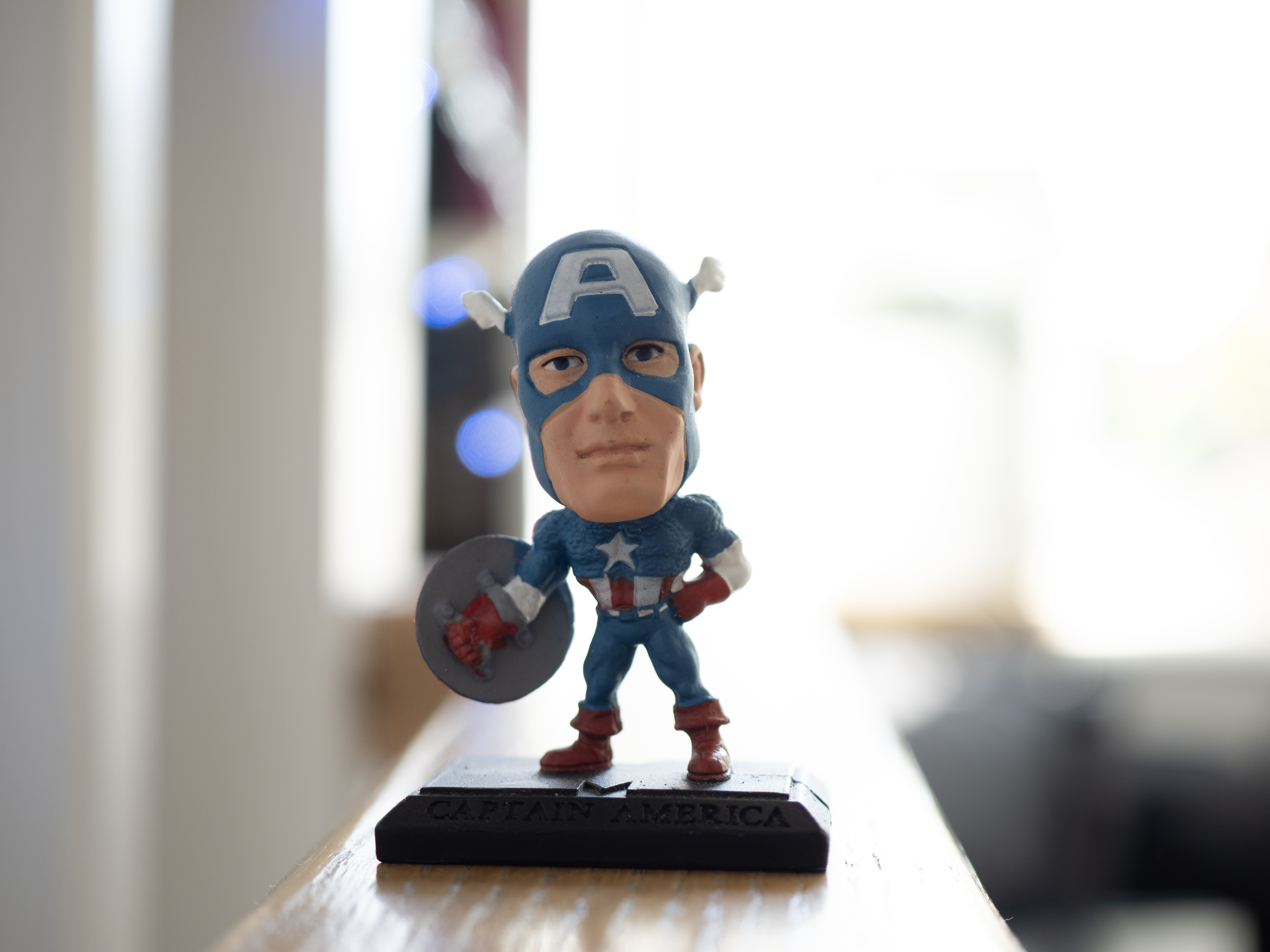 A miniature model of Captain America, photographed with the OM System OM-5 Mark II's regular and High Res Shot modes