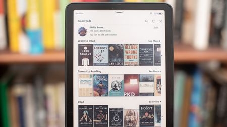 Amazon Kindle Colorsoft Signature edition e-reader showing graphic novels, cookbooks, and fiction, as well as settings
